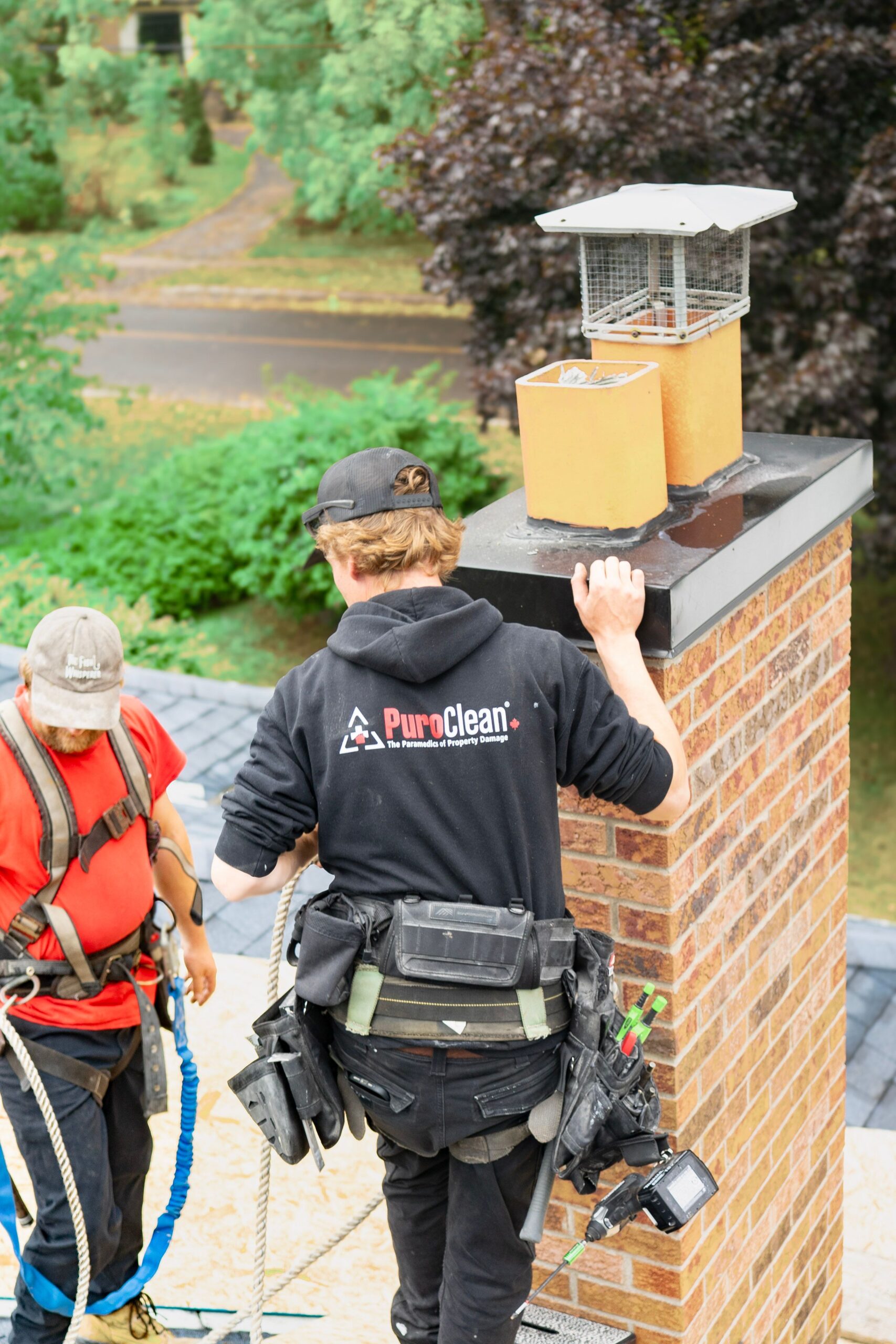 Roofer conducting a rooftop inspection as part of a roof survey