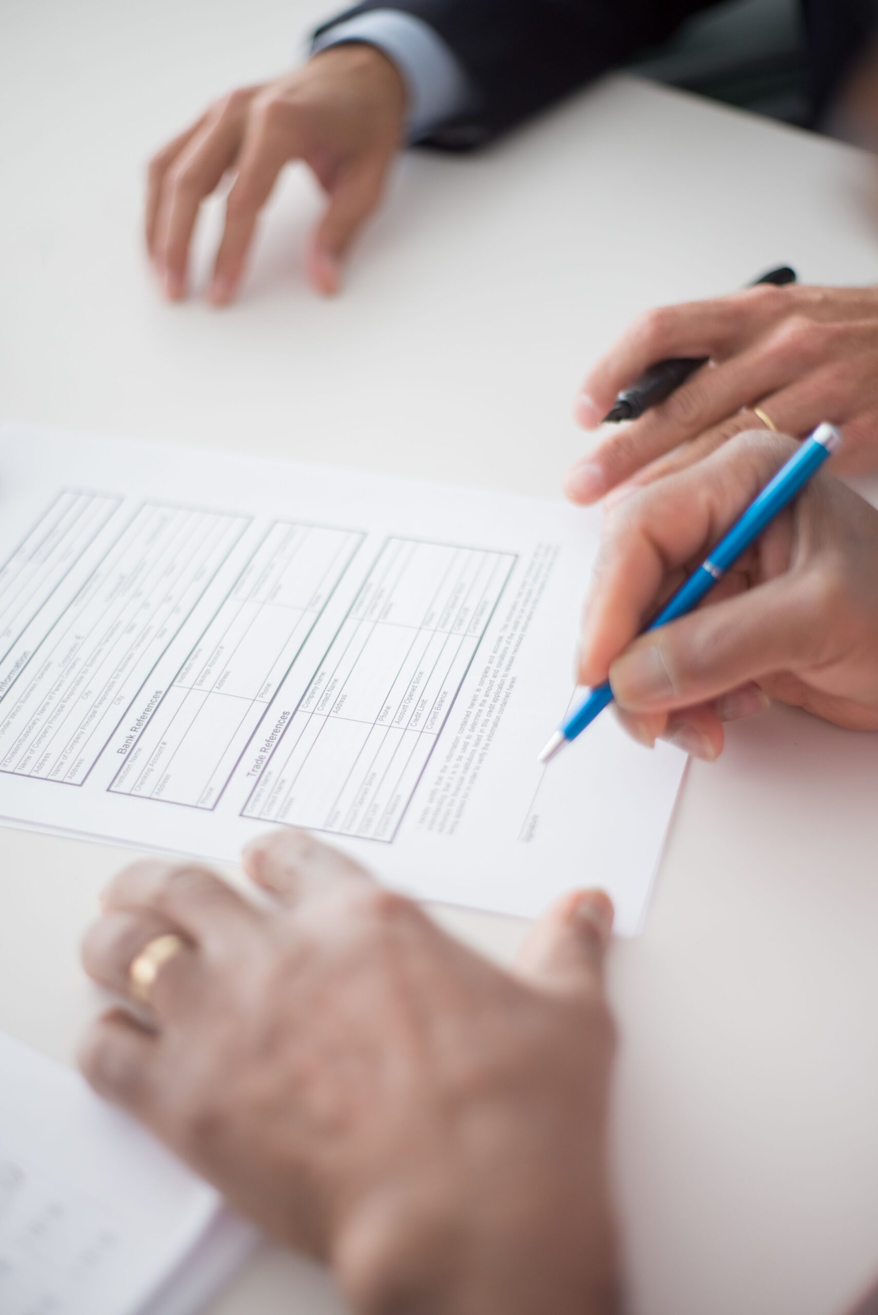 Signing a roof guarantee certificate document after a roofing job